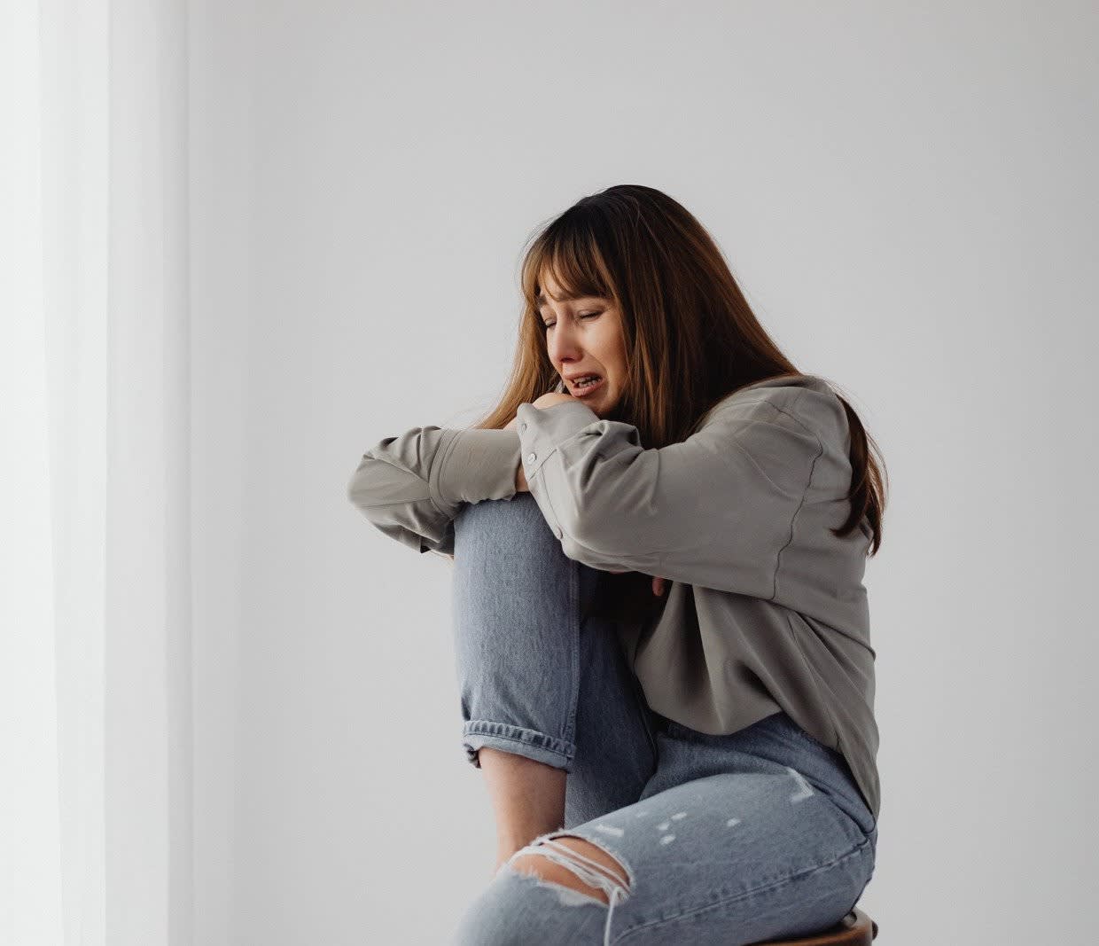 Why Grief Amplifies Pain, Fatigue, and Brain Fog—and the Somatic Path Back to Clarity