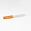 Small tool with orange handle and white blade on a white background