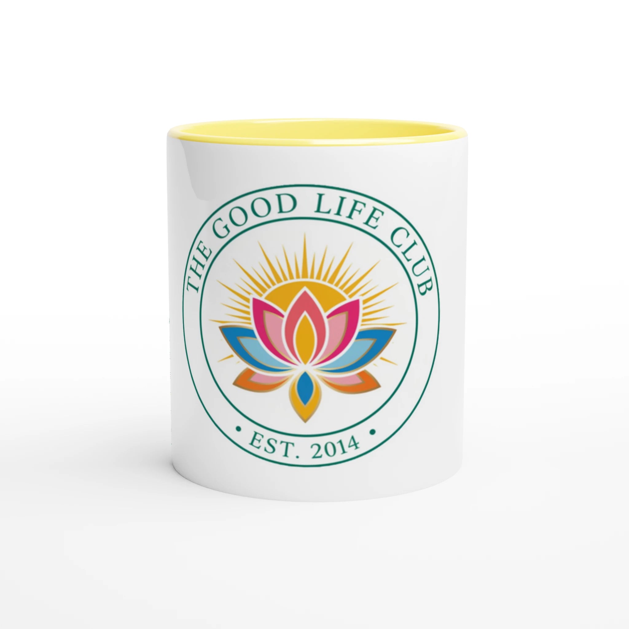 White mug with yellow interior and 'The Good Life Club' logo featuring a colorful lotus flower on a white background.