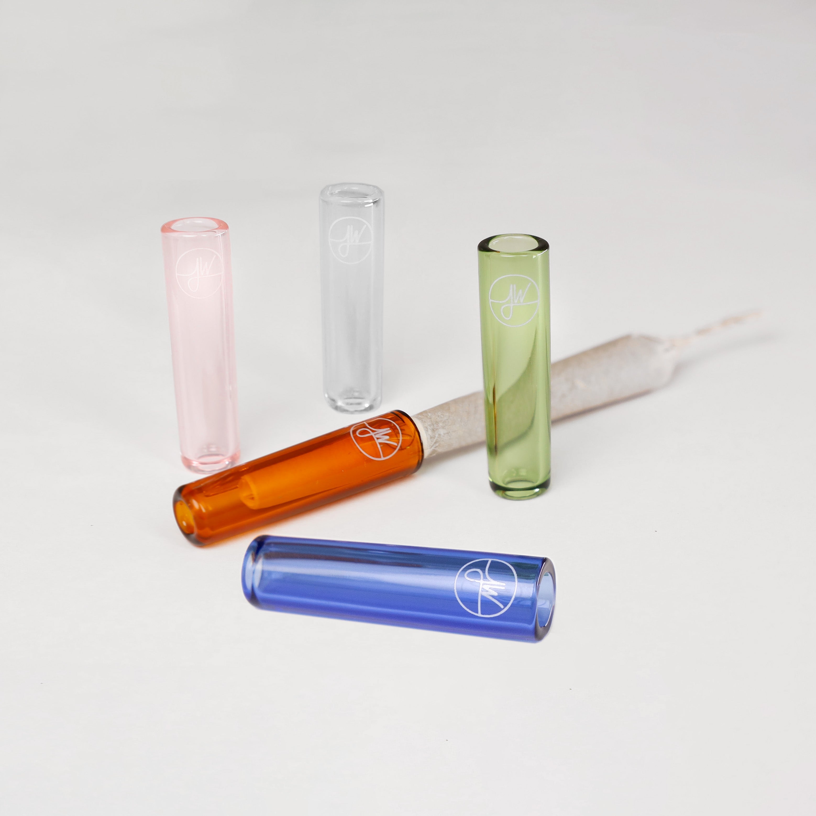 Set of colorful glass joint tips on a white background
