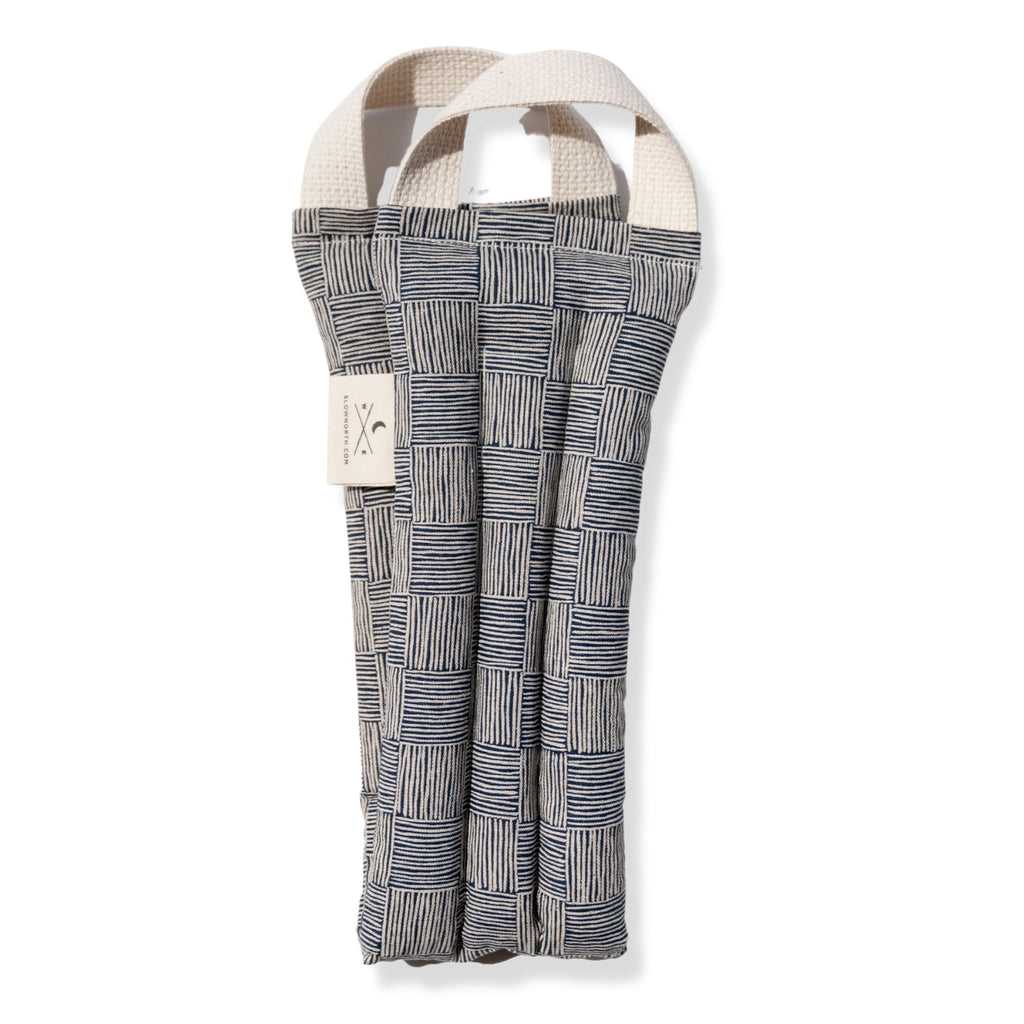 Woven neck wrap with geometric pattern on a white background