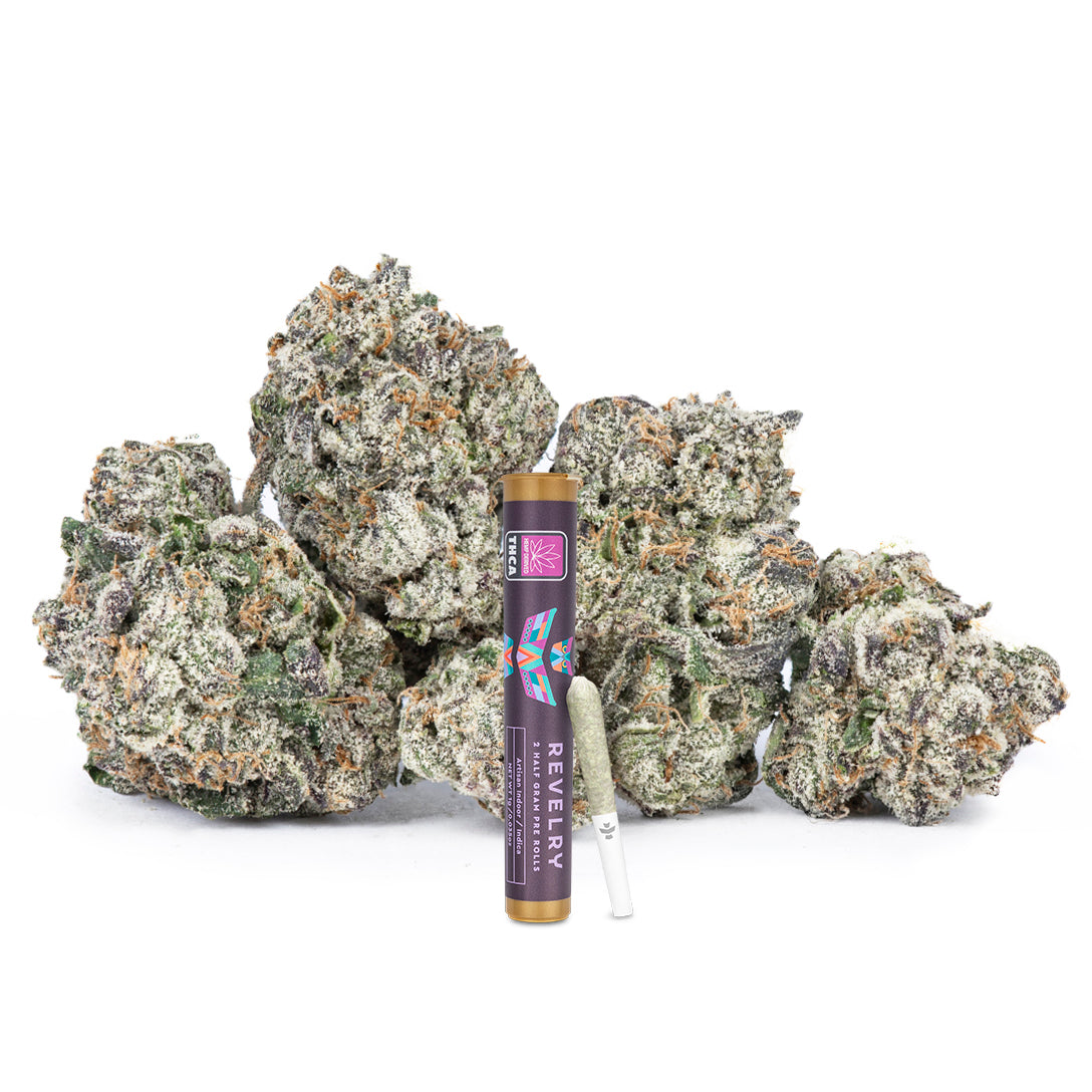 Marijuana buds and a vape pen on a white background