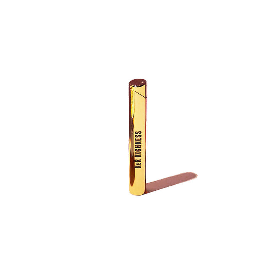 Gold-colored lip gloss with 'Her Highness' branding on a white background