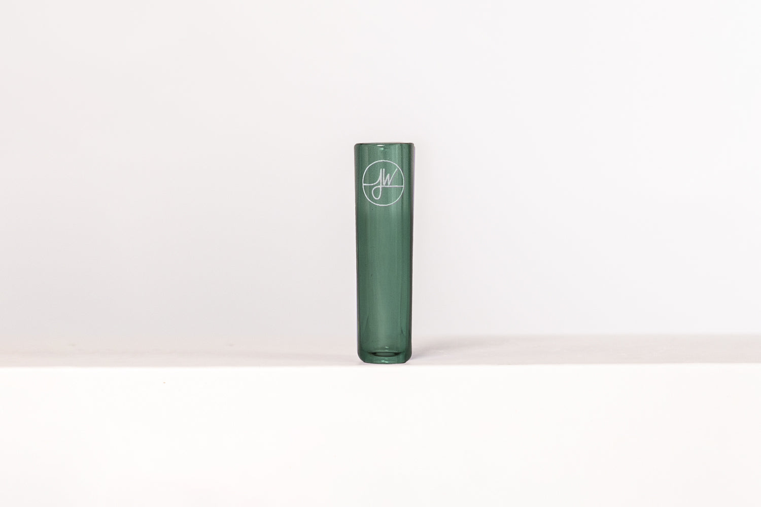 Green joint tip with a logo on a white background
