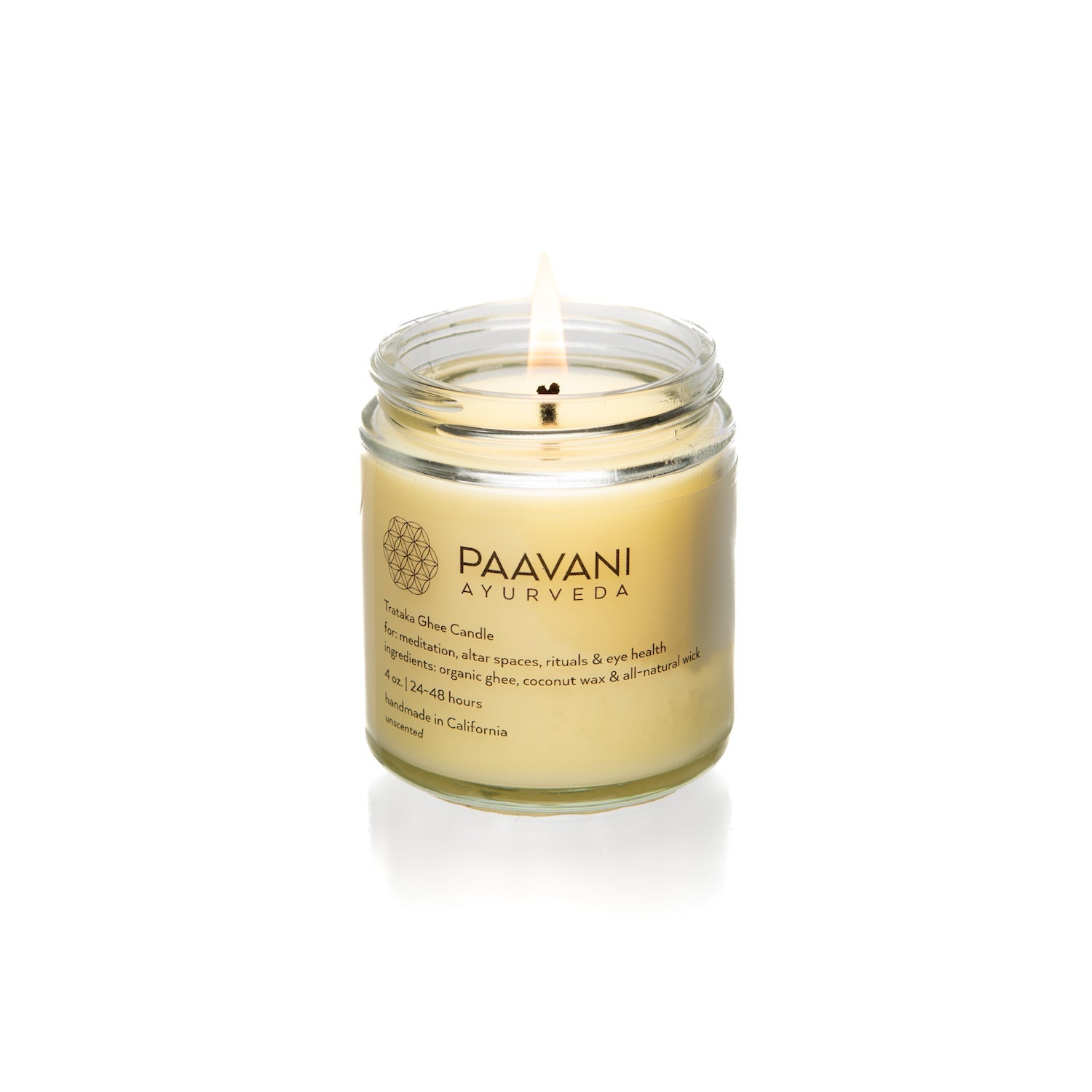 Paavani Ayurveda candle in a glass jar on a white background