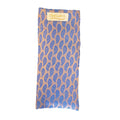 Blue leaf patterned eye pillow with 'OMSutra' branding on a beige background