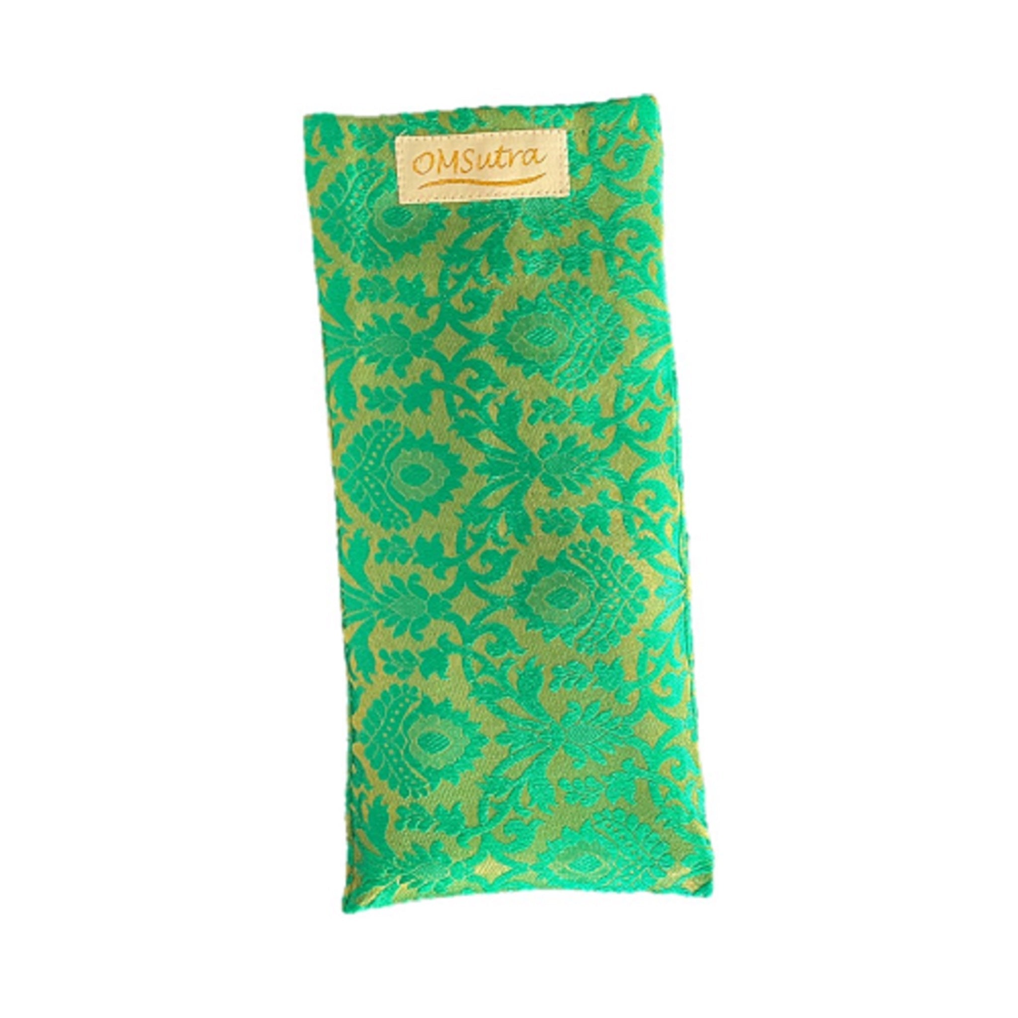 Green patterned eye pillow with 'OmSutra' branding on a white background