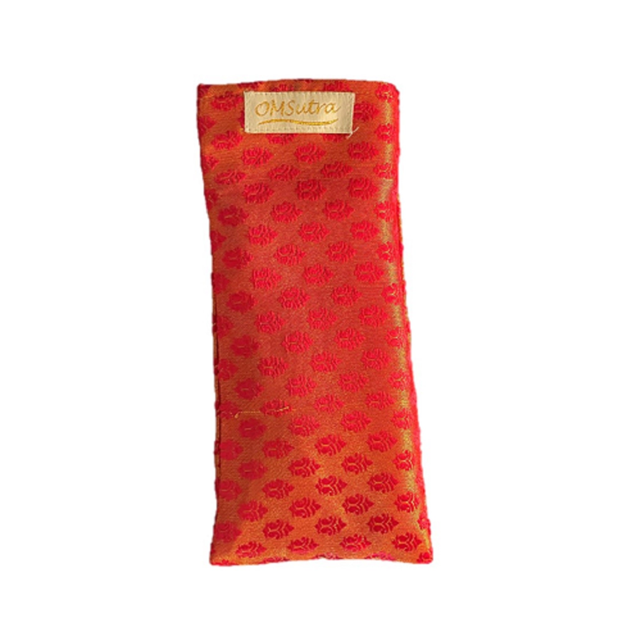 Red eye pillow with floral pattern and 'OmSutra' label on a white background