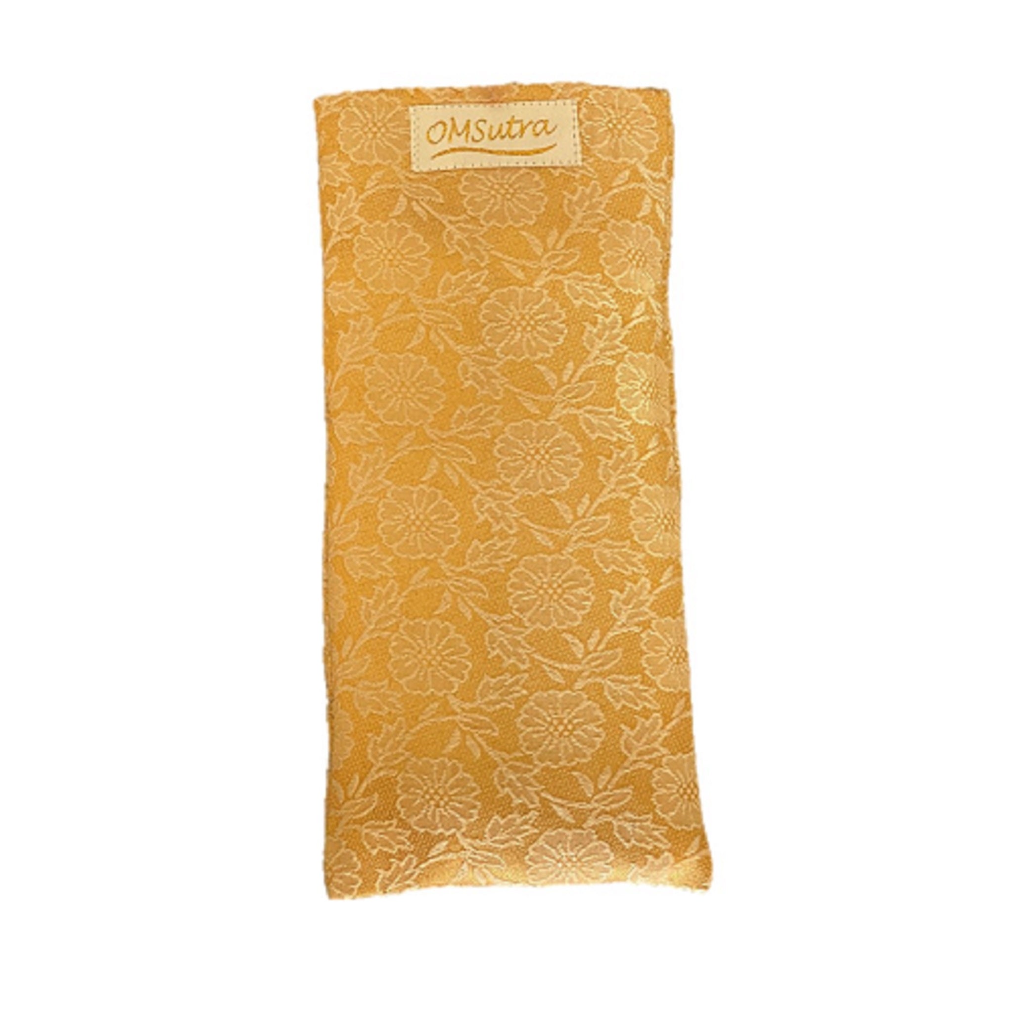 Yellow eye pillow with floral pattern and 'OmSutra' label on a white background
