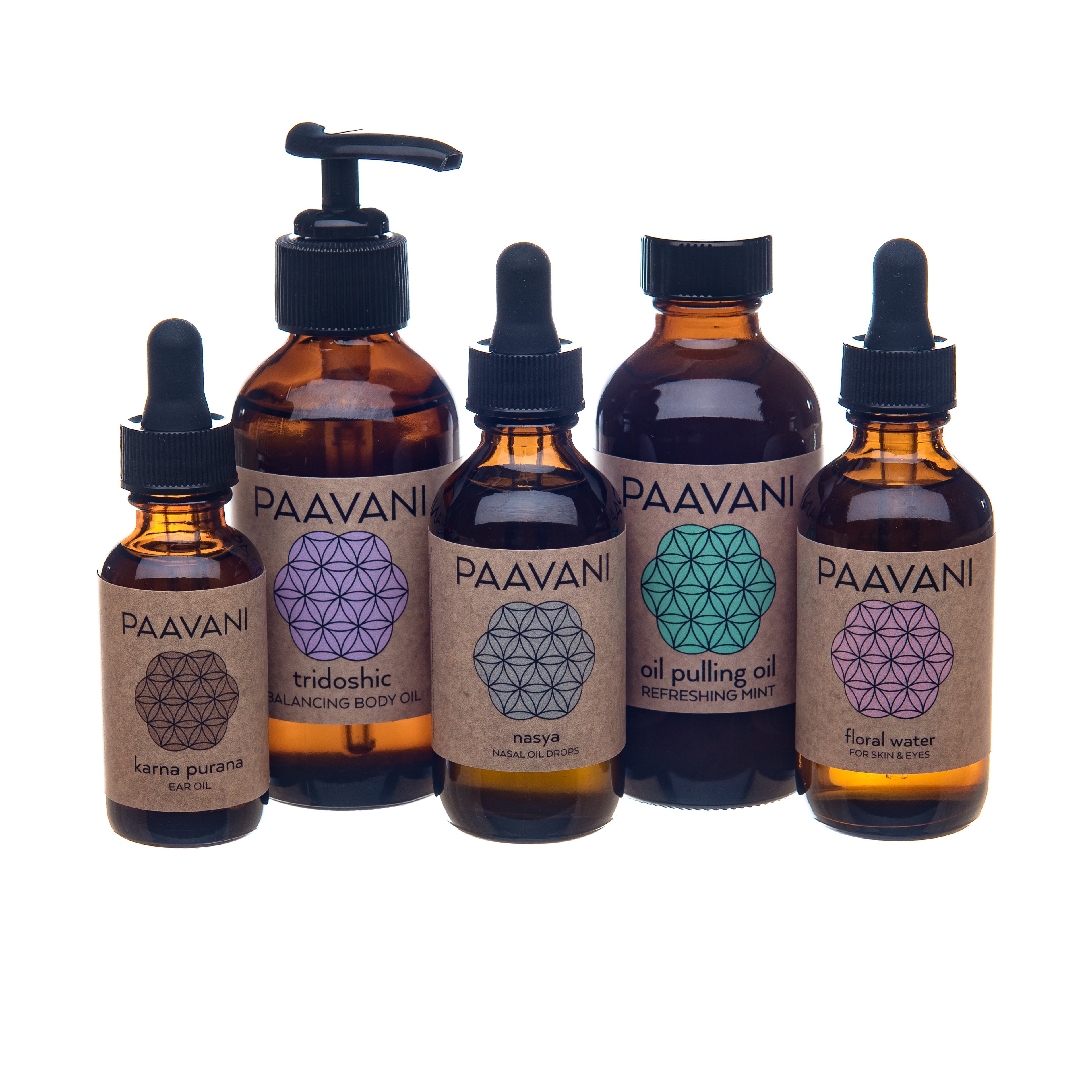 Set of PAAVANI Ayurveda oil bottles with different shapes on labels against a white background