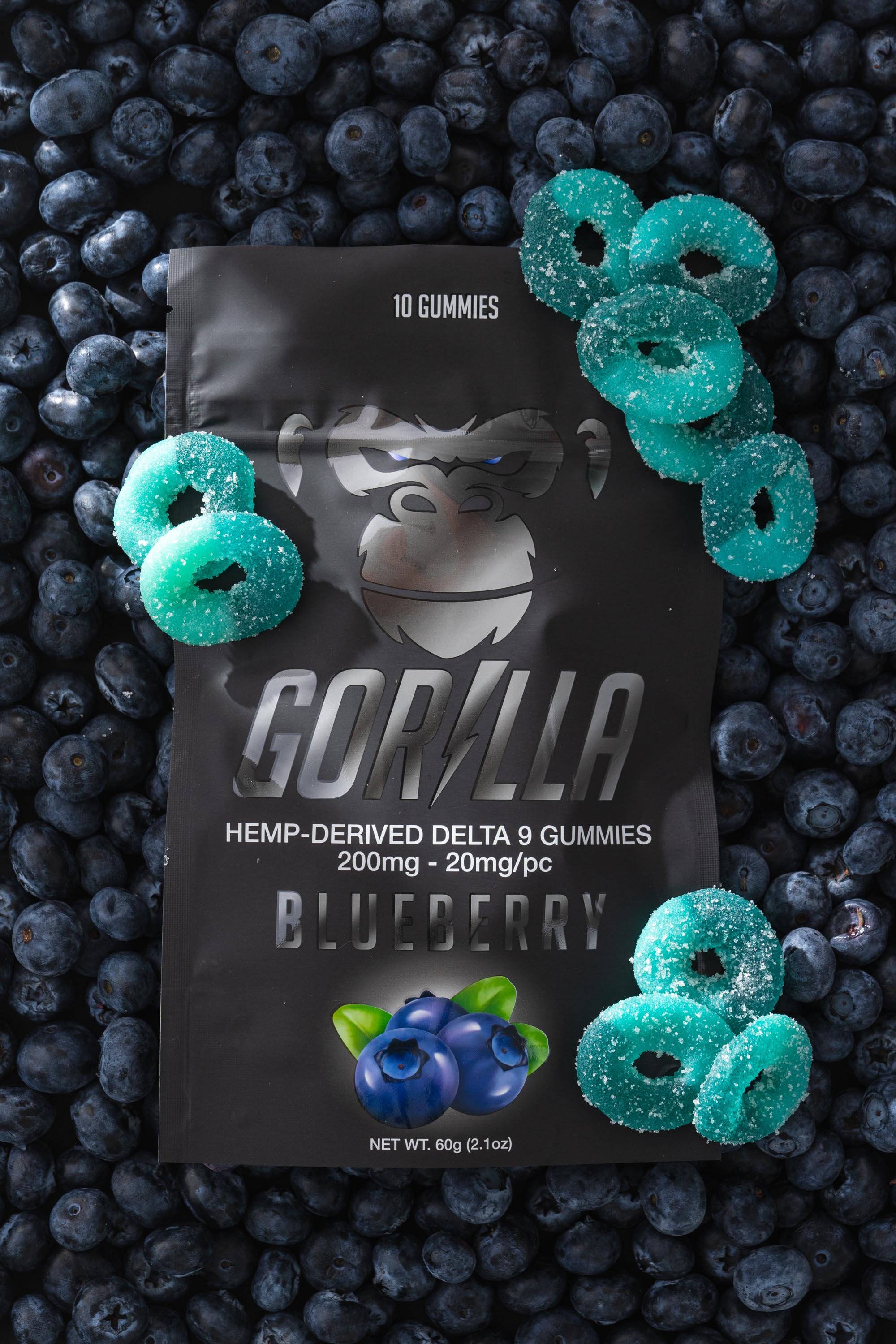 Gorilla Delta 9 gummies packaging with blueberries on a blueberry background