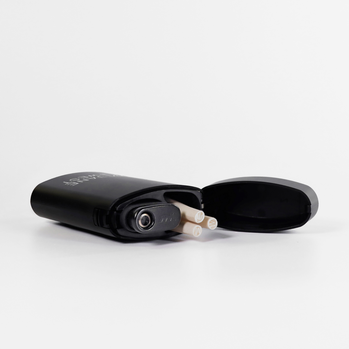 Black electronic device with cylindrical components on a white background