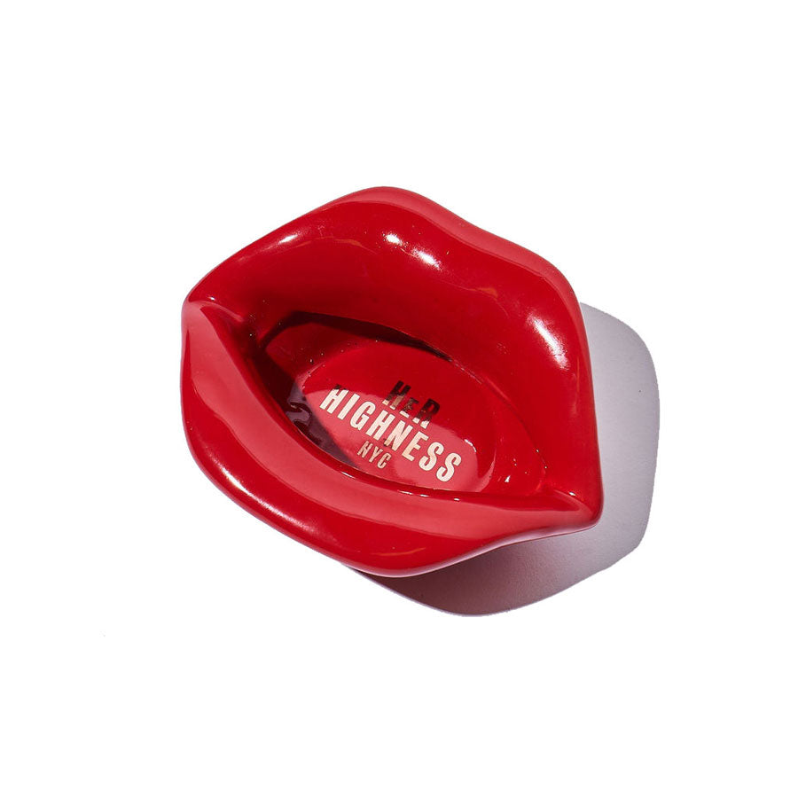 Red lip-shaped container with 'Highness NYC' branding on a white background