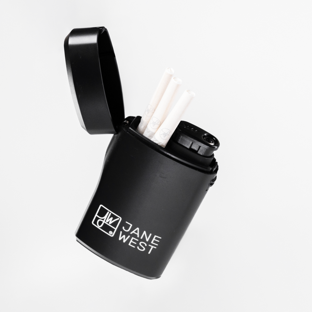 Black Jane West container with open lid on a white background