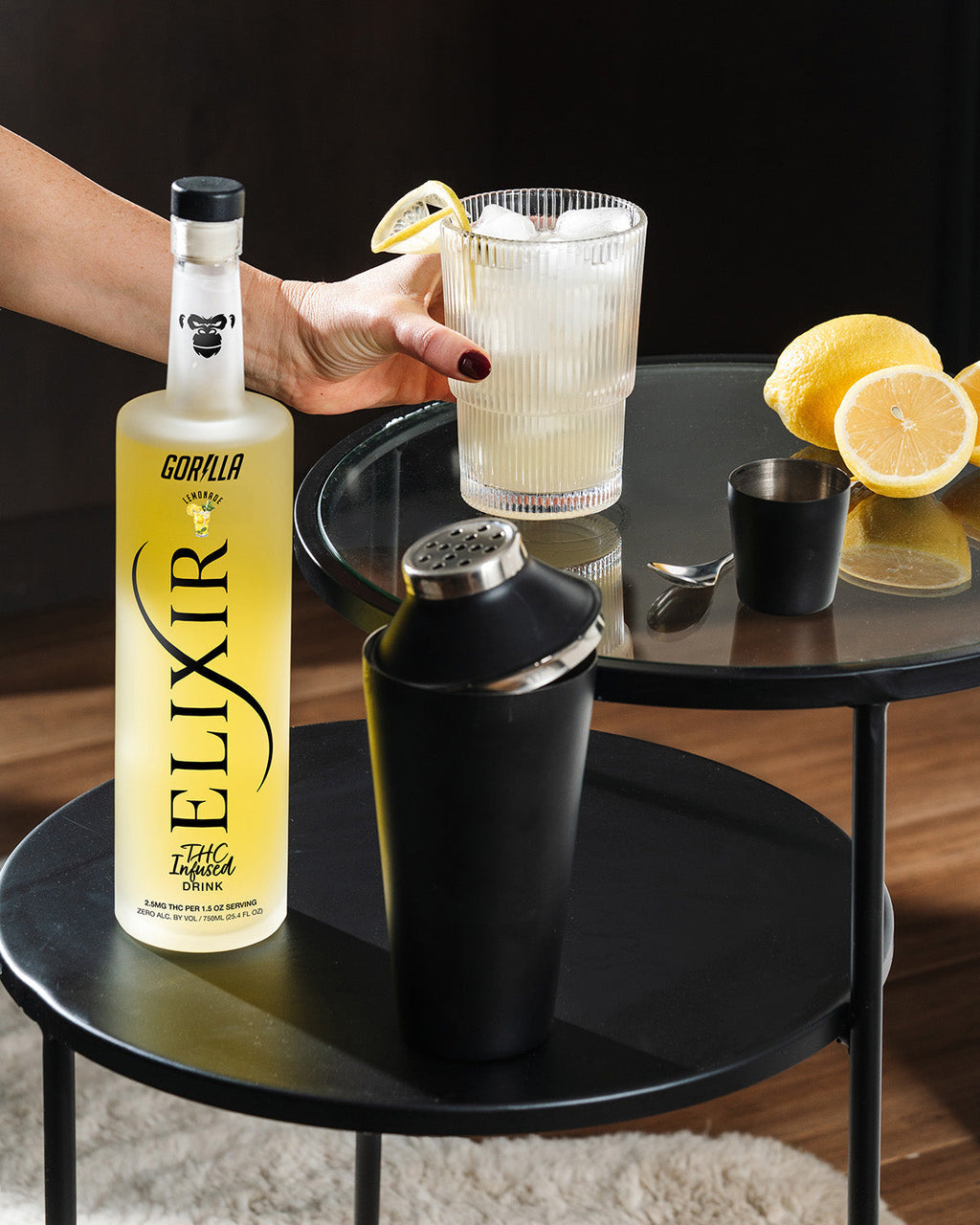 Bottle of Elixir Gorilla with a cocktail on a table