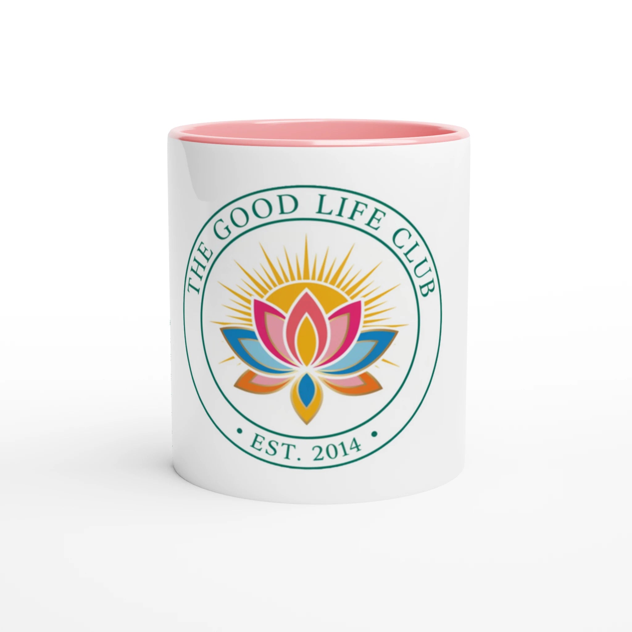 White mug with pink interior and 'The Good Life Club' logo featuring a colorful lotus flower on a white background.