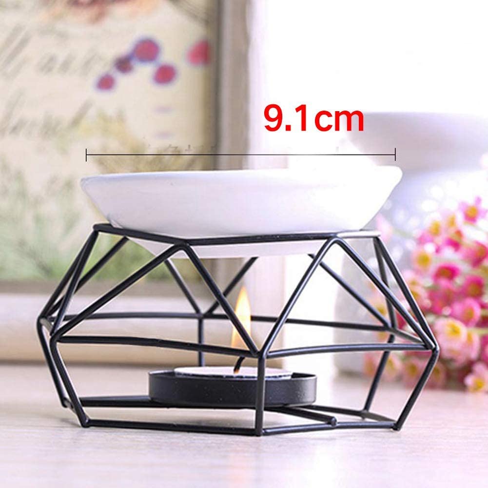 Geometric candle holder with a white bowl on top, placed on a surface with a blurred background.